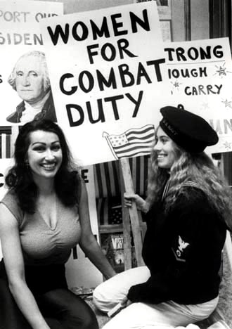 Female Empowerment and Women's Equality. Big breasted, black haired Kellie creating signs to protest for women to be allowed in the army and combat duty