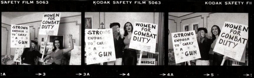 Panoramic film roll clip of Kellie Everts and a female activist preparing for protest for Female Empowerment with signs for Women's Rights demonstration