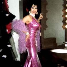 3 Months At The Playboy Club 1978. Big breasted stipper in shining purple skin tight gown , white pearls and matching performance boa